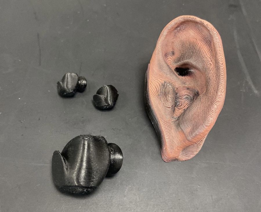 3D-printed earpiece prototypes and ear model